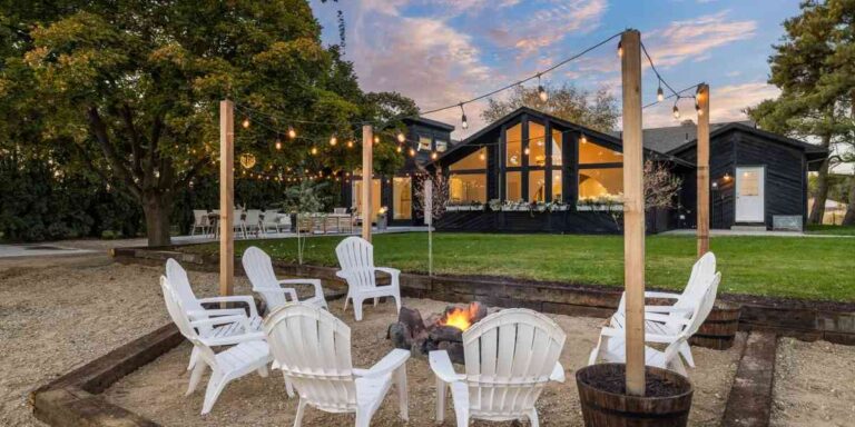 Common Pitfalls to Avoid When Improving Your Outdoor Living Spaces professionally-designed-outdoor-space-with-sitting-area-lightning-and-long-trees