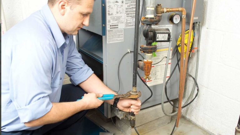 What Happens When You Delay Furnace Repairs? a-skilled-technician-is-shown-executing-repairs-on-a-heating-system