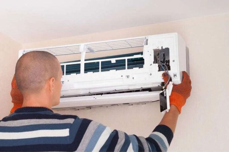 Is Your AC Running But Not Cooling? Some Common Causes You Shouldn’t Ignore a-technician-is-seen-working-on-a-split-unit-air-conditioner
