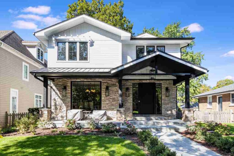 modern-well-designed-two-story-house-with-clean-and-stylish-exterior-with-a-mix-of-white-walls-and-stone-cladding-on-the-lower-portion