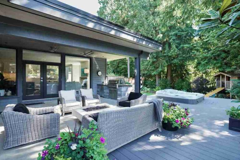 the-space-is-anchored-by-large-comfortable-wicker-style-sectional-sofa-with-plush-cushions-and-a-matching-coffee-table-creating-a-primary-lounge-zone