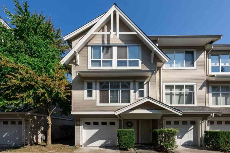 a-modern-multi-story-suburban-home-the-exterior-is-finished-in-a-light-grey-siding-with-crisp-white-trim-creating-a-clean-and-updated-look