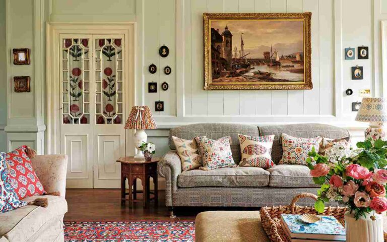 a-soft-pale-or-grey-tufted-sofa-is-centrally-positioned-adorned-with-several-patterned-throw-pillows