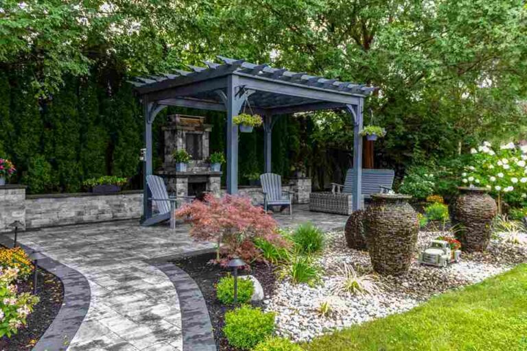professionally-designed-backyard-landscape-with-a-large-dark-grey-wooden-or-aluminium-pergola-as-a-structural-centerpiece